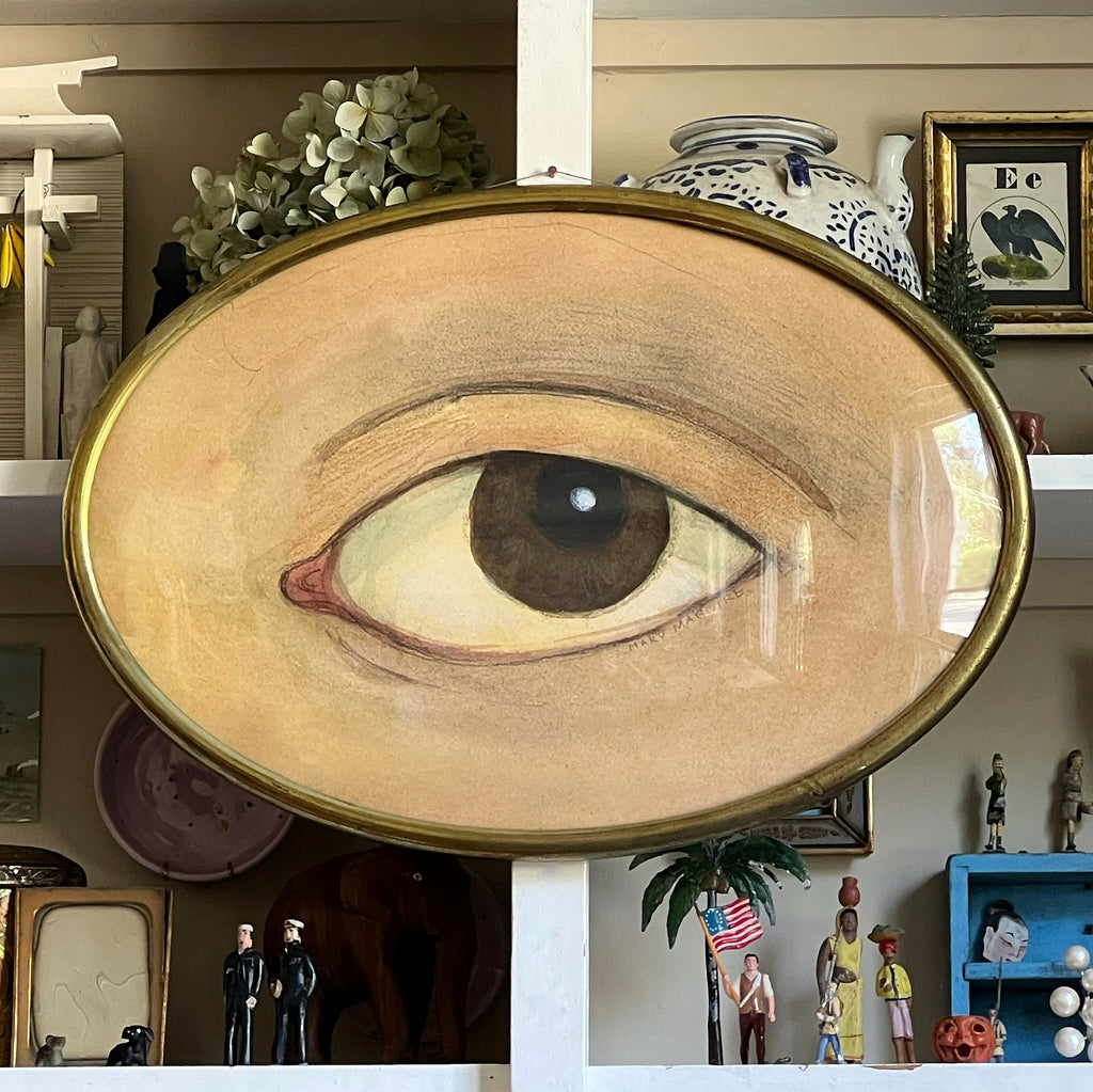 Brown 'Lover's Eye' -framed in brass